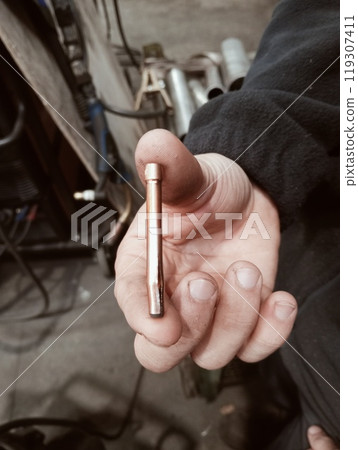 TIG torch spare parts inside a carpentry shop TIG torch spare parts inside a carpentry shop 119307411
