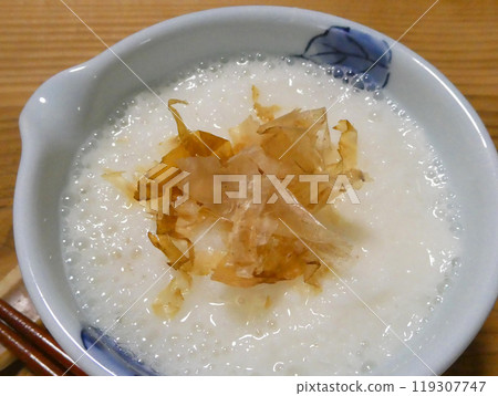 A photo of grated yam with bonito flakes to enhance the flavor A photo of grated yam with bonito flakes to enhance the flavor 119307747