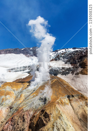 Steaming Fumarole on Snow-Capped Volcano 119308325