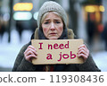 Woman Holding I Need a Job Sign 119308436