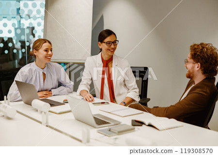 A meeting with professionals collaborating to achieve common goals and objectives 119308570