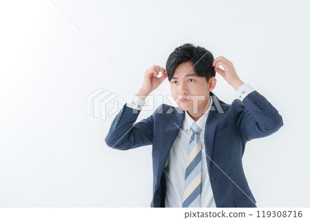 Businessman doing hair styling 119308716