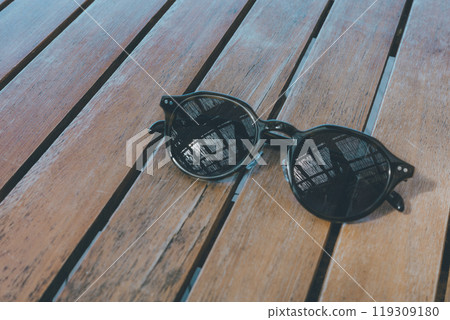 Sunglasses and wooden deck Sunglasses and wooden deck 119309180