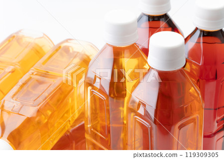 Close-up of plastic bottles of different kinds of tea Close-up of plastic bottles of different kinds of tea 119309305
