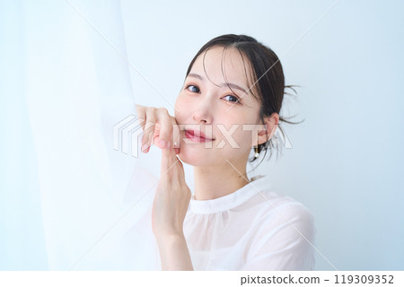 Woman in white image Woman in white image 119309352