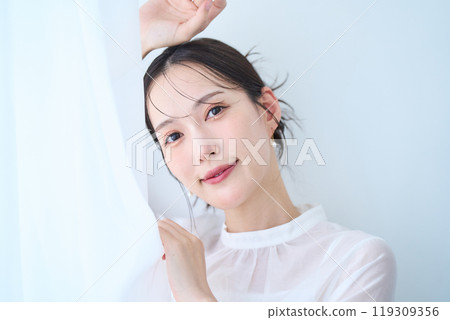 Woman in white image Woman in white image 119309356