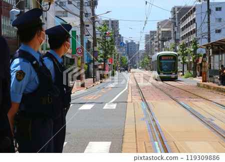 Police officers on guard at a tram stop (2 men, upper body, partial face illustration) Police officers on guard at a tram stop (2 men, upper body, partial face illustration) 119309886