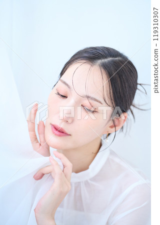Woman in white image Woman in white image 119310307