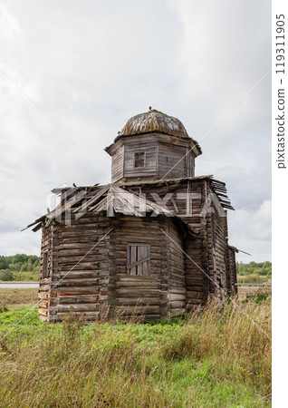 Destroyed wooden church in northern russian village Destroyed wooden church in northern russian village 119311905