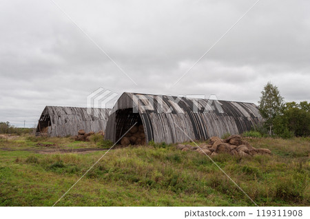 Hangars with bales of hay Hangars with bales of hay 119311908