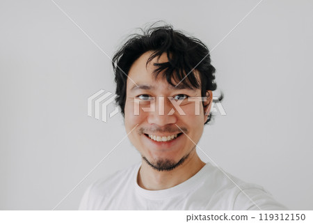 Happy smile face man taking selfie of himself isolate on white background. 119312150