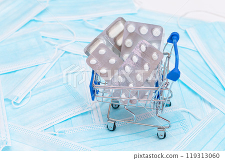 Pills and Capsules in Shopping Cart on the Surgical Masks 119313060