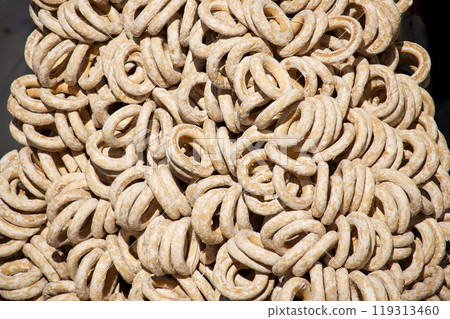 Artistic close-up of traditional round bread rings varieties stacked together 119313460