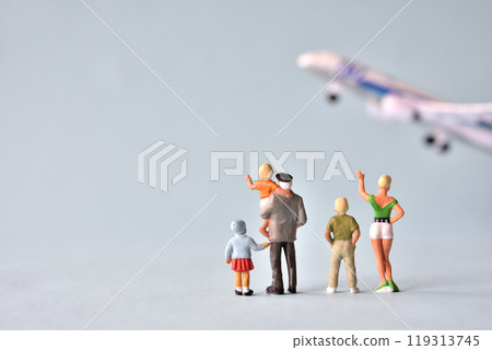 Image of a family waving goodbye to an airplane Image of a family waving goodbye to an airplane 119313745