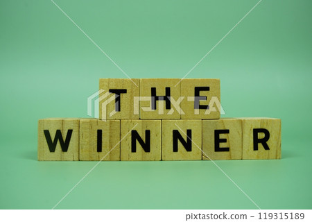 The Winner with wooden blocks alphabet letters on green background The Winner with wooden blocks alphabet letters on green background 119315189
