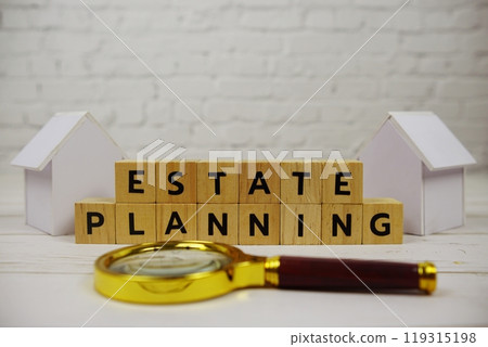 Estate Planning with wooden blocks alphabet letters and magnifying glass and white 119315198