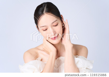 Young woman with a gentle expression Young woman with a gentle expression 119315866