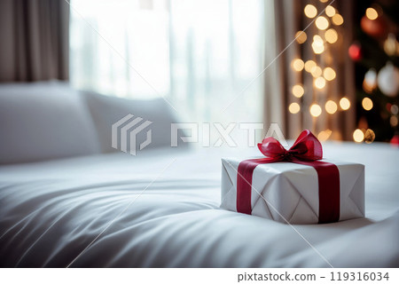 Christmas gift on bed with white bedding. sunny morning with shadow. Christmas gift on bed with white bedding. sunny morning with shadow. 119316034