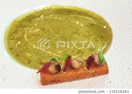 pea soup with croutons on a white dish at restaurant pea soup with croutons on a white dish at restaurant 119316263