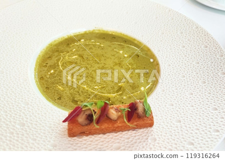 pea soup with croutons on a white dish at restaurant pea soup with croutons on a white dish at restaurant 119316264
