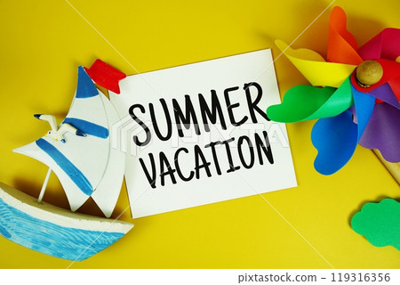 Summer Vacation text on paper card with marine items decorative and pinwheel top view on yellow background Summer Vacation text on paper card with marine items decorative and pinwheel top view on yellow background 119316356