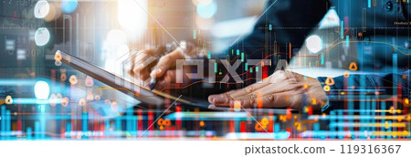 In the image, a man dressed in a suit is seen holding a tablet and a pen 119316367