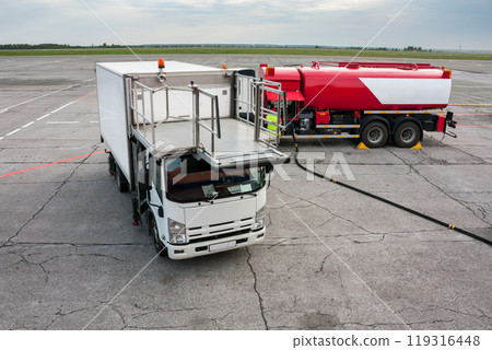 Airport catering truck and refueling truck on apron Airport catering truck and refueling truck on apron 119316448