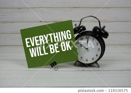 Everything Will Be Ok text message on paper card with alarm clcok on wooden background Everything Will Be Ok text message on paper card with alarm clcok on wooden background 119316575