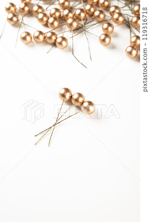 Artificial berries on a wire for needlework and decoration of gifts, wreaths on white background Artificial berries on a wire for needlework and decoration of gifts, wreaths on white background 119316718