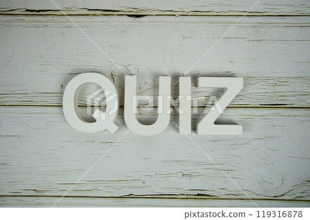 Quiz alphabet letters top view on wooden background 119316878