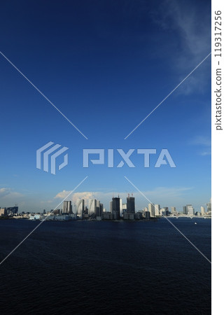 Summer clouds over Tokyo Bay and buildings seen from Rainbow Bridge 119317256