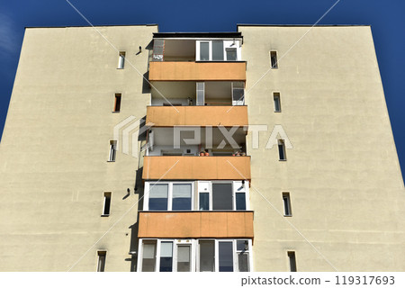 Typical facade of concrete panel building. Post Soviet flat of blocks 119317693
