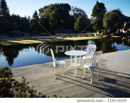 White table set in museum garden 119318045