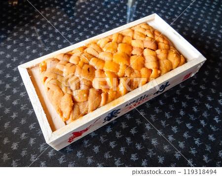 Fresh sea urchin in a wooden box Fresh sea urchin in a wooden box 119318494