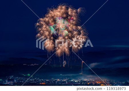 The Katakai Town Fireworks Festival in Niigata Prefecture is the Guinness World Record for the largest fireworks festival in the world, with 400,000 fireworks. A bird's-eye view shot from the mountain. 119318973