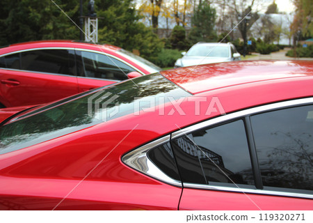 Vehicles On The Open Air Public Car Park At Evening Time 119320271