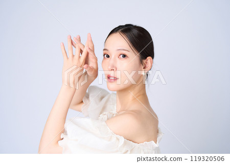 Young woman with a gentle expression Young woman with a gentle expression 119320506