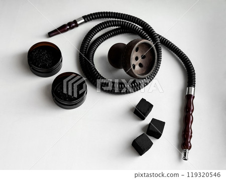 Modern hookah setup with charcoal and tobacco on white background Modern hookah setup with charcoal and tobacco on white background 119320546