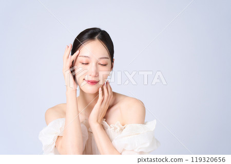 Young woman with a gentle expression Young woman with a gentle expression 119320656