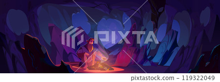 Man sitting near bonfire in dark cave 119322049