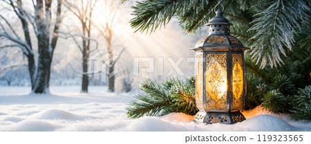 Christmas lantern illuminating a snowy forest with warm light at sunset, creating a magical winter wonderland Christmas lantern illuminating a snowy forest with warm light at sunset, creating a magical winter wonderland 119323565