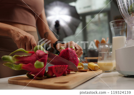 Model Cutting Dragonfruit During Shooting Model Cutting Dragonfruit During Shooting 119324139