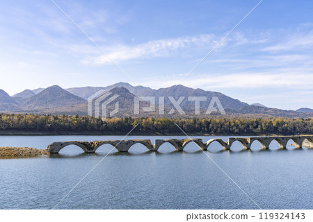 Taushubetsu River Bridge on the former Shihoro Line of the Japanese National Railways on a clear autumn day in Kamishihoro, Hokkaido Taushubetsu River Bridge on the former Shihoro Line of the Japanese National Railways on a clear autumn day in Kamishihoro, Hokkaido 119324143