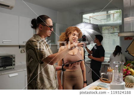 Director Talking To Model During Shooting Director Talking To Model During Shooting 119324188