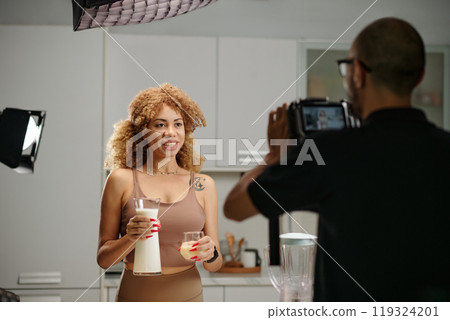 Cameraman Shooting Model For Advert Cameraman Shooting Model For Advert 119324201