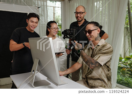 Director Working With Crew In Office 119324224