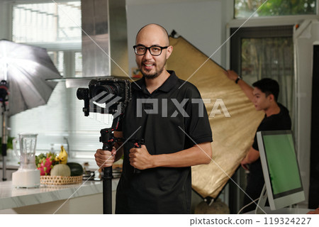 Cameraman With Camera Ready For Shooting 119324227