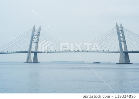 distant bridge over foggy bay on rainy day distant bridge over foggy bay on rainy day 119324856