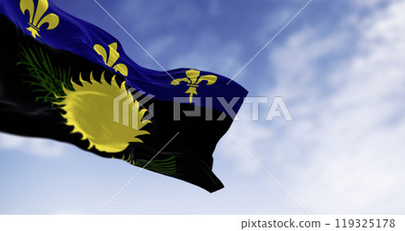 Guadeloupe flag waving in the wind on a clear day Guadeloupe flag waving in the wind on a clear day 119325178