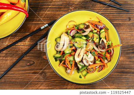 Spicy squid salad with mix vegetables. 119325447